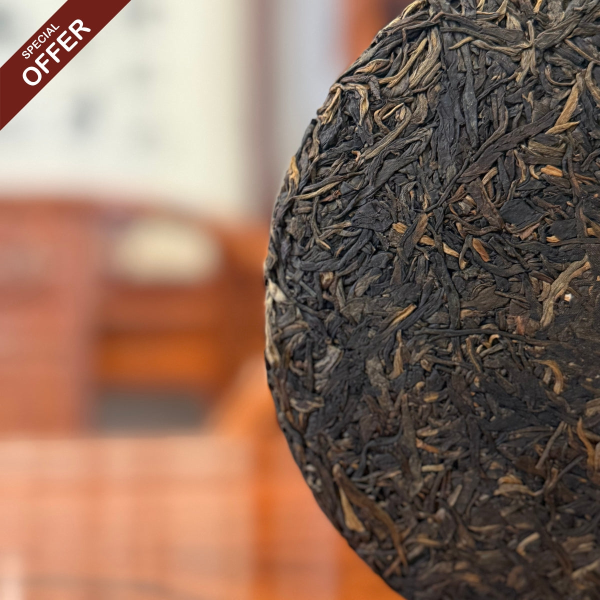 Close-up detail of the compressed leaves of the 2018 Bing Dao Ancient Tree Raw Pu'er Tea Cake