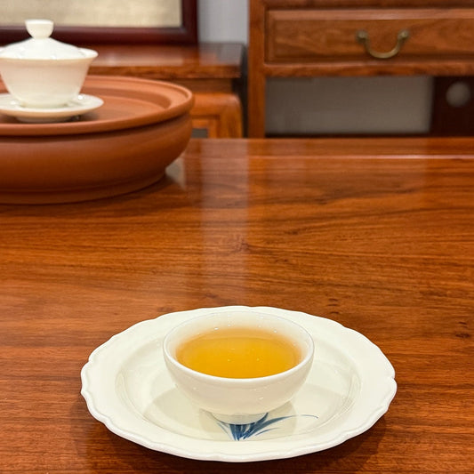 Brewed Pu-erh tea liquor in a traditional tea room cup at Chinese Tea Group
