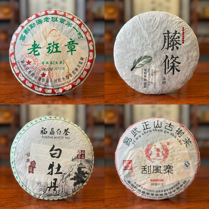Chinese Tea Group authentic tea cakes arranged vertically: Pu-erh, white, and dark varieties.