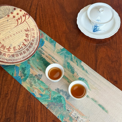 2003 Bulang Mountain raw Pu-erh tea cake and brewed tea liquor