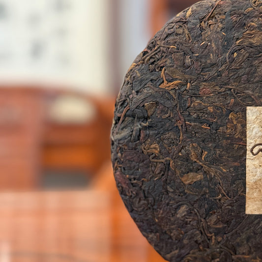 Detailed texture of 2008 vintage Big Snow Mountain raw Pu-erh tea cake