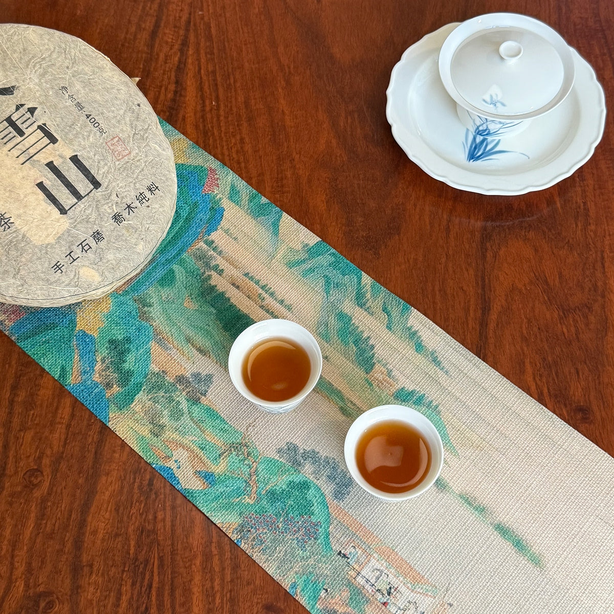 2008 Big Snow Mountain aged raw Pu-erh tea cake with brewed tea liquor