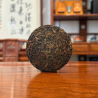 2009 Xigui Raw Puerh Tea Cake On Tea Table