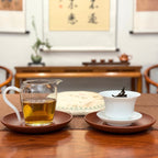 2015 Fuding Gong Mei White Tea Cake (Tribute Eyebrow) with brewed Chinese white tea liquor