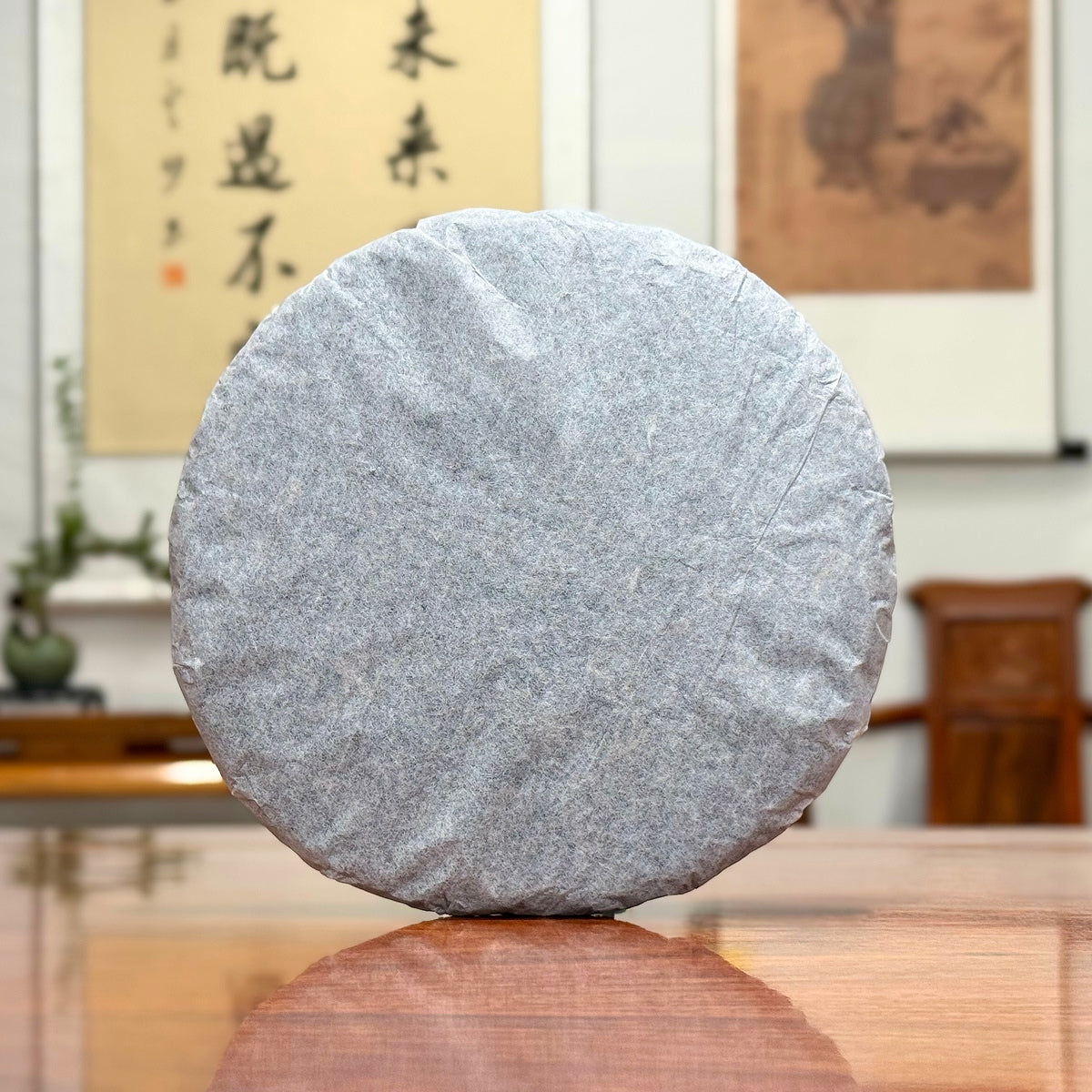 2016 He Kai Raw Pu-erh Tea Cake with traditional inner cotton paper wrapping for authentic aged Pu-erh tea storage