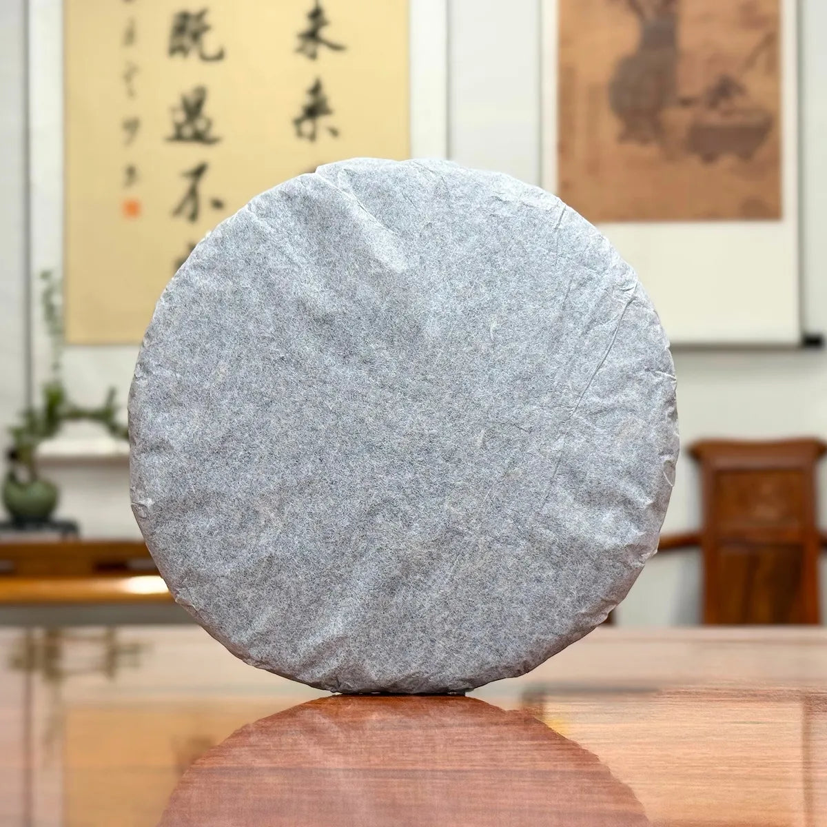 2016 He Kai Raw Pu-erh Tea Cake with traditional inner cotton paper wrapping for authentic aged Pu-erh tea storage