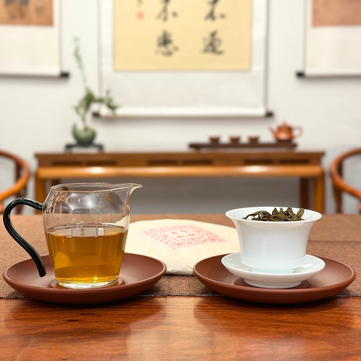 2016 He Kai Raw Pu-erh Tea Cake with tea liquor display highlighting the harmony of aged Pu-erh tea