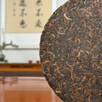2017 Special-Grade Ripe Pu-erh Tea Cake with close view of tightly compressed tea leaves and fine texture