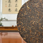 2017 Special-Grade Ripe Pu-erh Tea Cake with close view of tightly compressed tea leaves and fine texture
