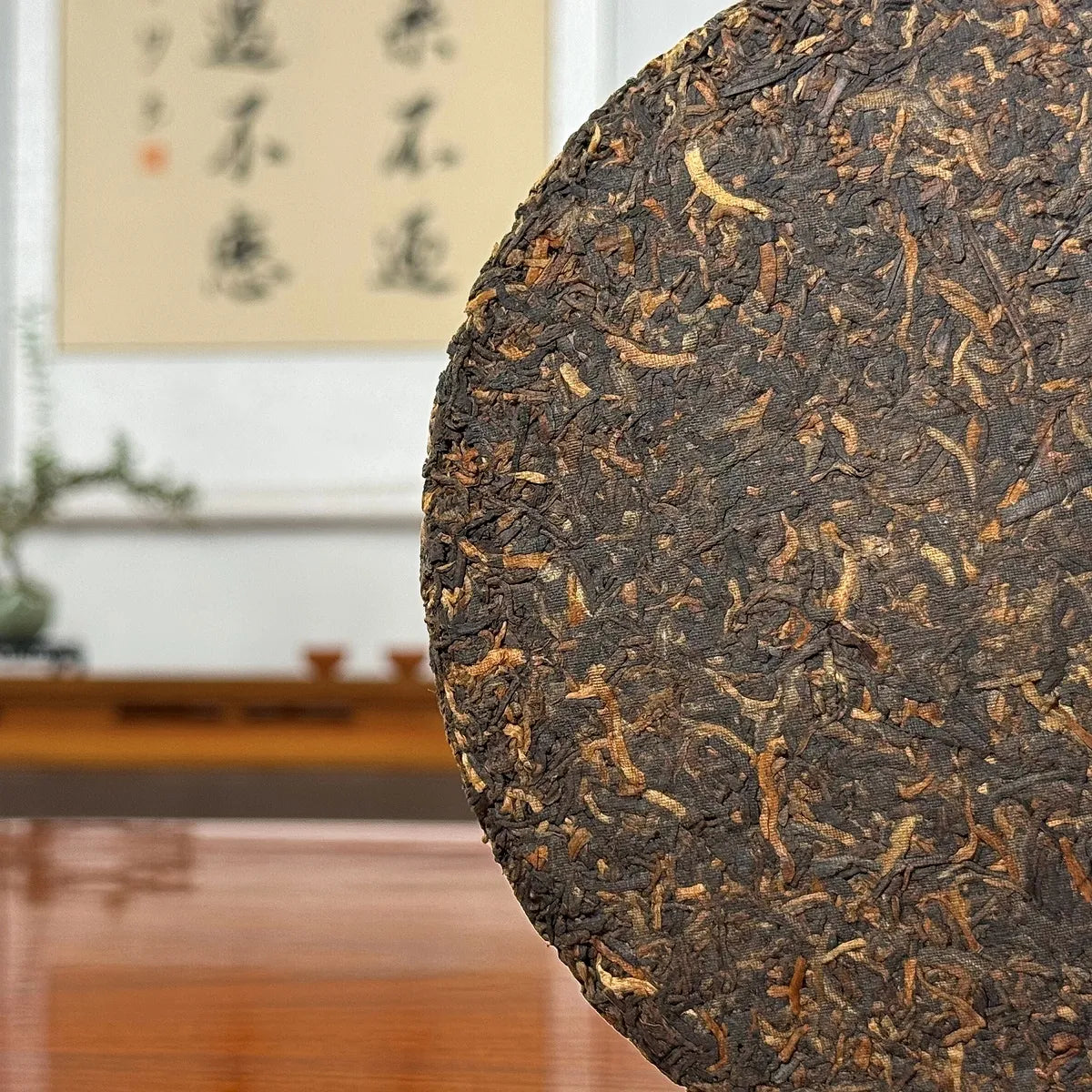 2017 Special-Grade Ripe Pu-erh Tea Cake with close view of tightly compressed tea leaves and fine texture