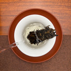 2018 Bing Dao Ancient Tree Raw Pu'er Tea Cake brewed in a traditional Chinese tea room