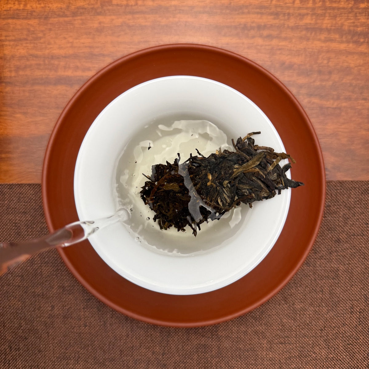 2018 Bing Dao Ancient Tree Raw Pu'er Tea Cake brewed in a traditional Chinese tea room