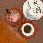 2018 Bing Dao Ancient Tree Raw Pu'er Tea Cake with brewed leaves and tea liquor showing the quality of ancient-tree tea