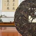 2018 Bing Dao Ancient Tree Raw Pu'er Tea Cake close-up showing detailed leaf texture and traditional pressed tea appearance