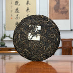 2018 Bing Dao Ancient Tree Raw Pu'er Tea Cake showing Yunnan tea leaf texture and natural ancient-tree material