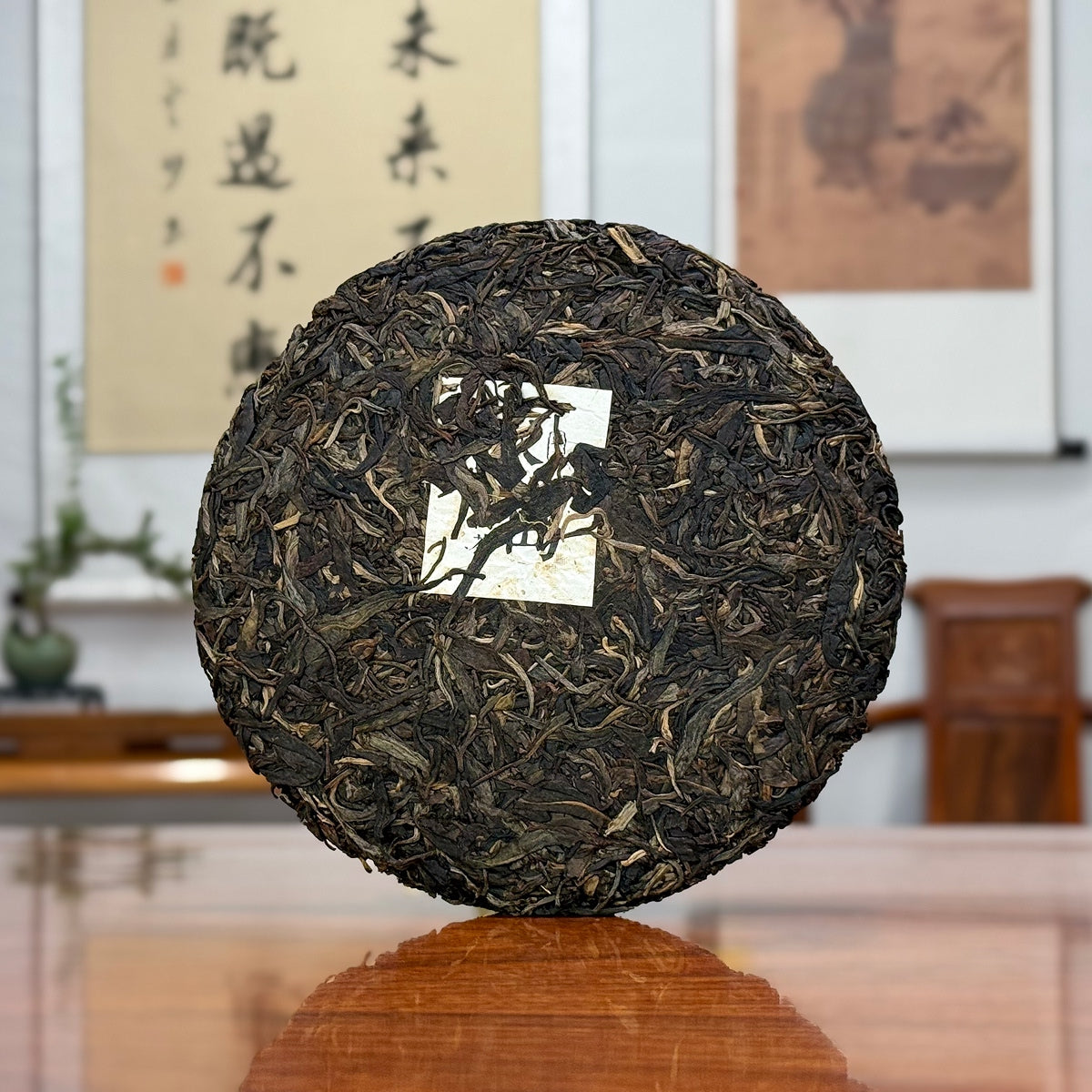 2018 Bing Dao Ancient Tree Raw Pu'er Tea Cake showing Yunnan tea leaf texture and natural ancient-tree material