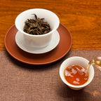 2018 Bing Dao Ancient Tree Raw Pu'er Tea Cake tea liquor after brewing, showing the clarity and color of aged Pu-erh tea