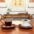 2018 Classic Ripe Pu-erh Tea Cake displayed with tea liquor and limited edition packaging
