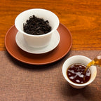 2018 Classic Ripe Pu-erh Tea Cake showing clear and rich red tea liquor after brewing