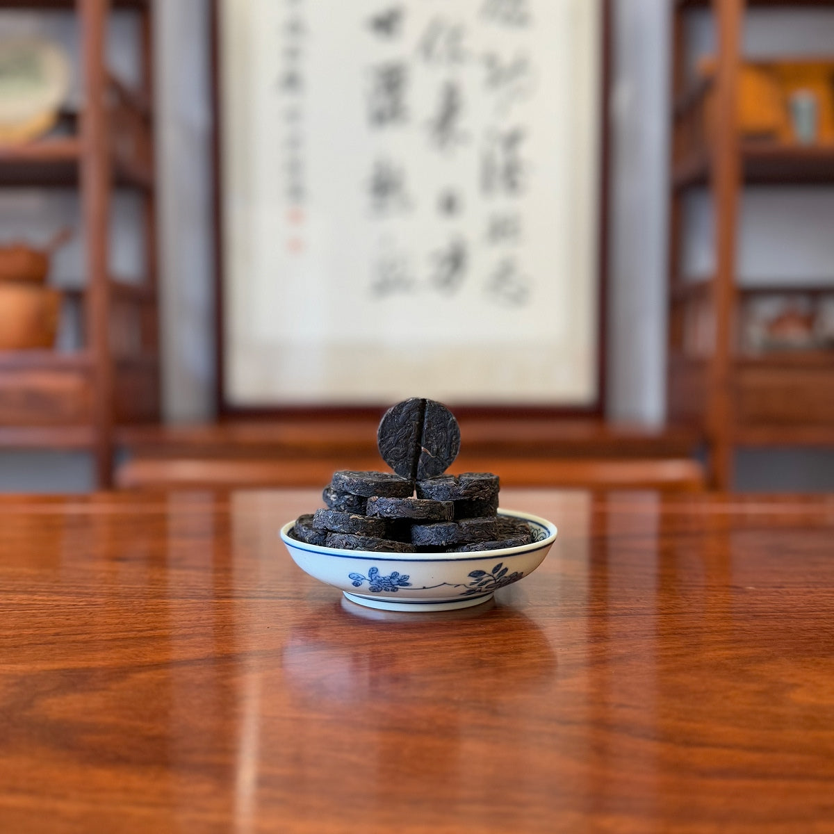 2018 Yunnan raw Pu-erh tea mini cake displayed by Chinese Tea Group