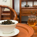 Brewing 2018 Yunnan raw Pu-erh tea mini cake in a traditional Chinese tea room