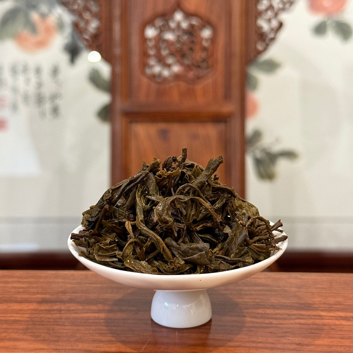 Wet tea leaves of 2018 Yunnan raw Pu-erh mini cake after brewing