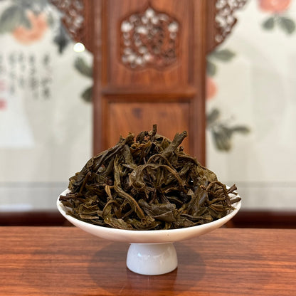 Wet tea leaves of 2018 Yunnan raw Pu-erh mini cake after brewing