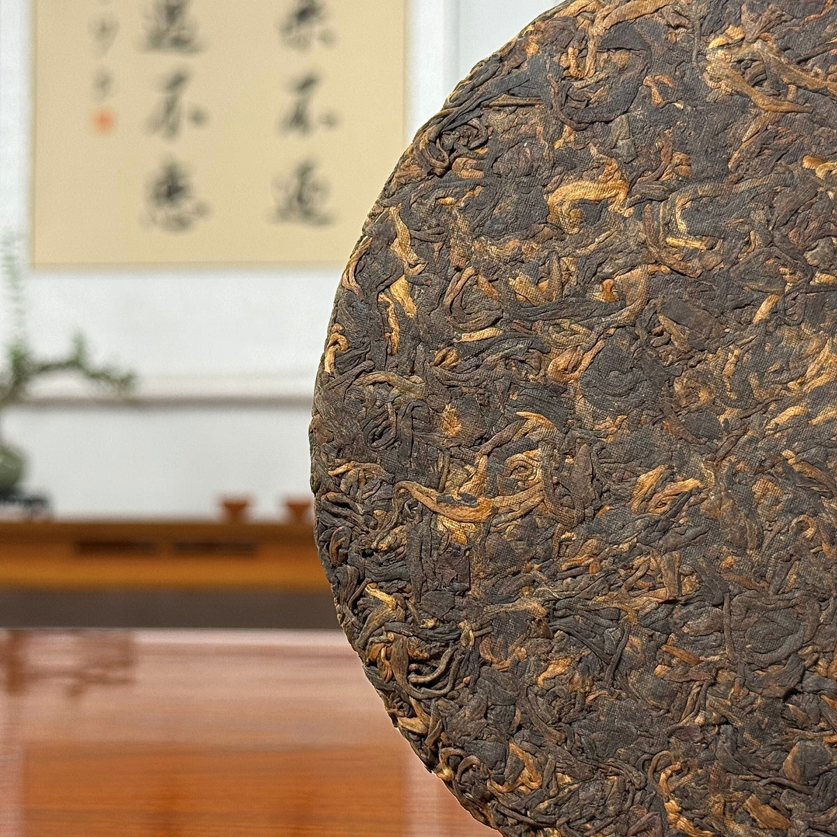 2019 Lao Ban Zhang Golden Tips Ripe Pu-erh Tea Cake showing detailed tea leaves and golden tips