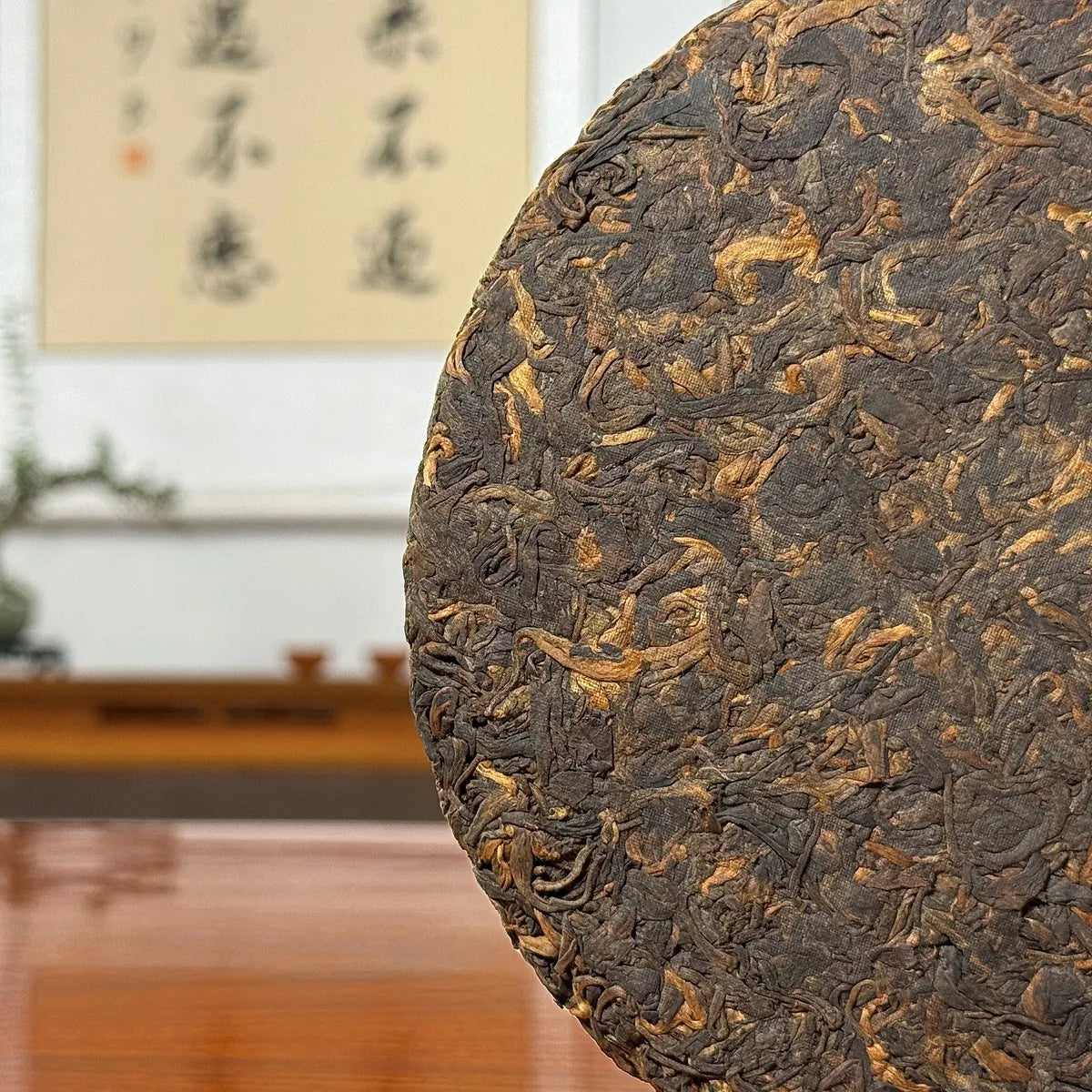 2019 Lao Ban Zhang Golden Tips Ripe Pu-erh Tea Cake showing detailed tea leaves and golden tips