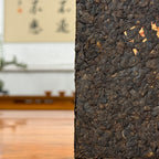 2019 Ripe Pu-erh Tea Brick showing detailed tea leaves and compressed brick texture