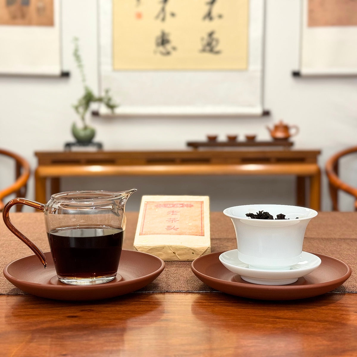 2019 Ripe Pu-erh Tea Brick displayed with brewed tea liquor and compressed tea brick