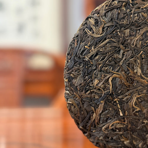2019 Wilds Raw Pu-erh Tea Cake - Close-Up of Pressed Leaves