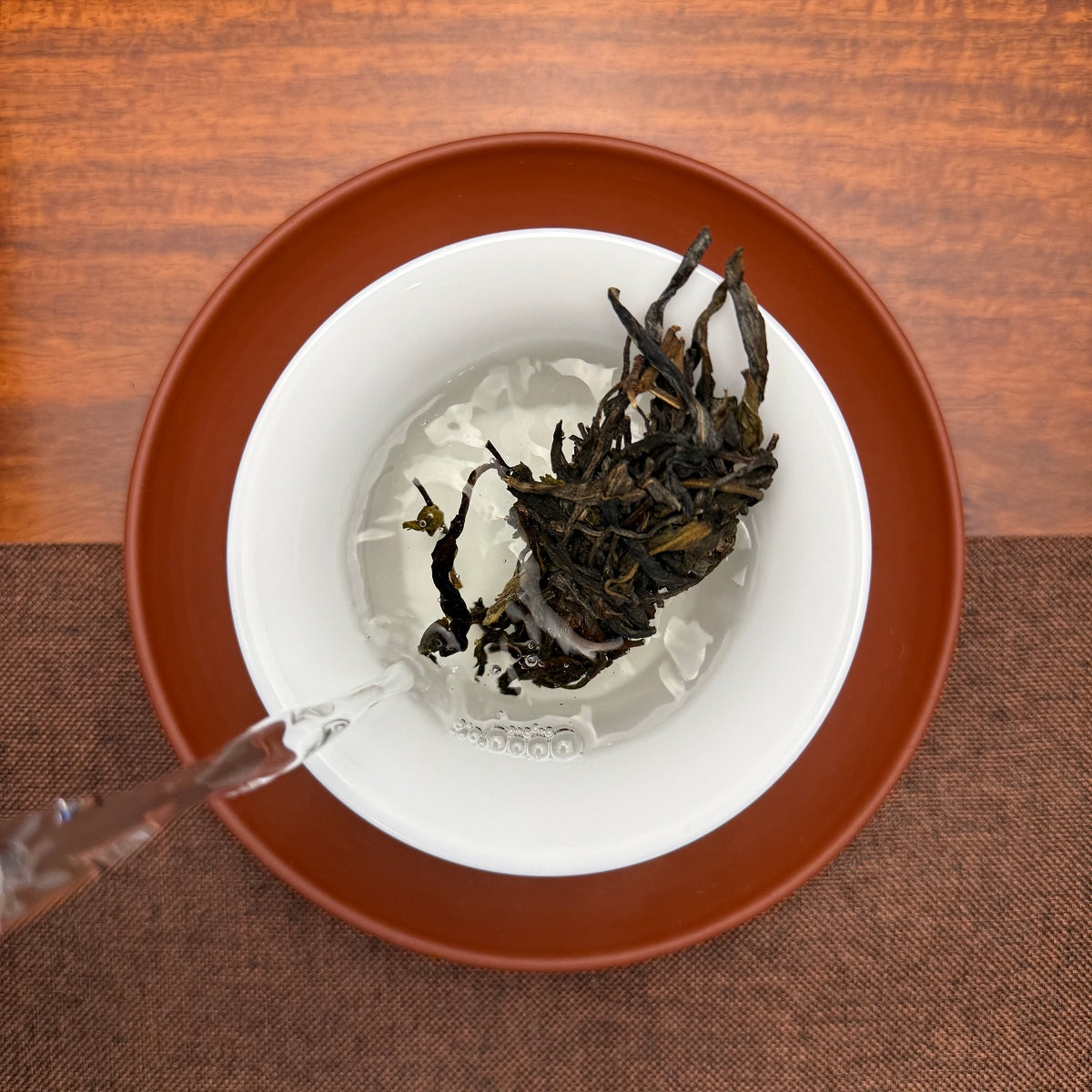2019 Yunnan Qizi Bing Raw Pu-erh Tea Cake (Sheng) being brewed at a Chinese Tea Group tea house