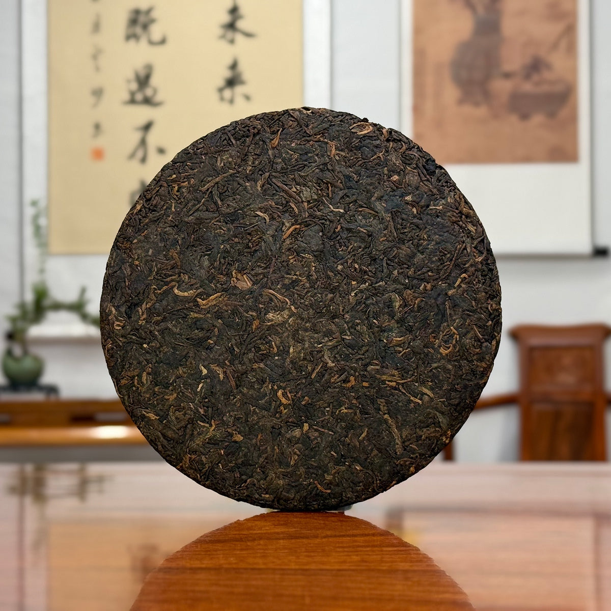 2019 Yunnan Qizi Bing Ripe Pu-erh Tea Cake close-up showing compressed cake texture