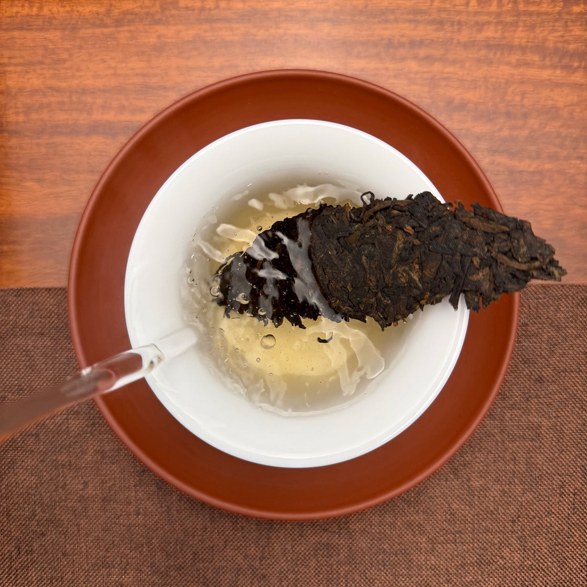 Brewing 2020 Arbor Tree Ripe Pu-erh Tea Cake (Shou) in a traditional Chinese tea setting