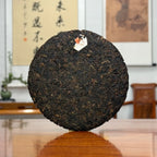 2020 Arbor Tree Ripe Pu-erh Tea Cake (Shou) with the inner ticket and compressed tea details