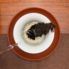 2020 Menghai Ripe Pu-erh Tea Cake (Shou) being brewed in a traditional Chinese tea room