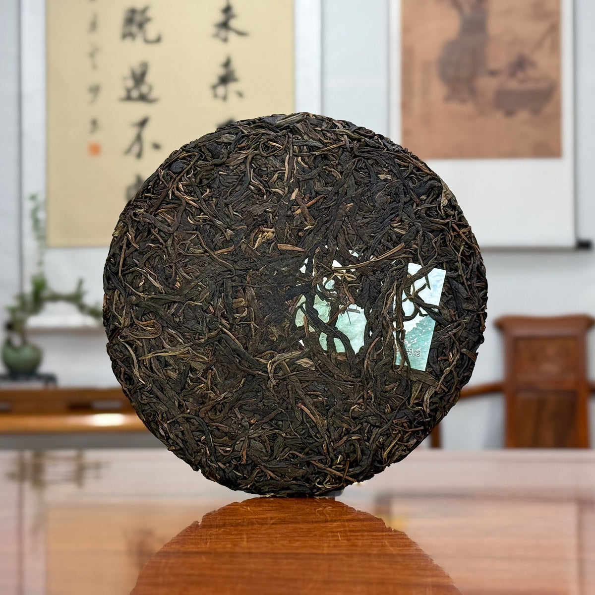 2020 Yiwu Mahei Raw Pu-erh Tea Cake showing detailed leaf texture and pressed tea structure