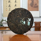 2020 Yiwu Mahei Raw Pu-erh Tea Cake showing detailed leaf texture and pressed tea structure