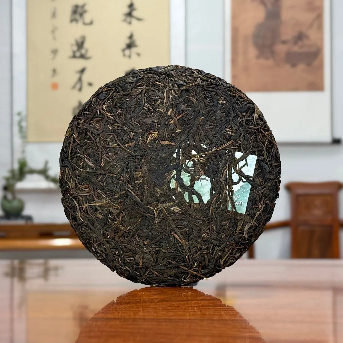 2020 Yiwu Mahei Raw Pu-erh Tea Cake showing detailed leaf texture and pressed tea structure