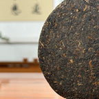 2021 Imperial-Grade Ripe Pu-erh Tea Cake (Shou) close-up showing fine buds and detailed tea leaf texture