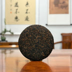 2021 Imperial-Grade Ripe Pu-erh Tea Cake (Shou) showing the full tea cake shape and fine tea details