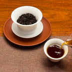 2021 Imperial-Grade Ripe Pu-erh Tea Cake (Shou) ripe Pu-erh tea liquor in a traditional teacup