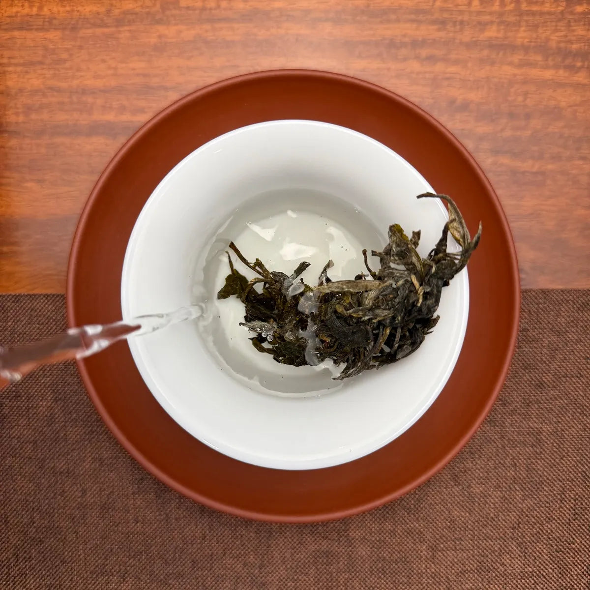 2022 Ban Pen Ancient Tree Raw Pu-erh Tea Cake brewed in a traditional Chinese tea room