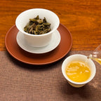 2023 Da Xue Shan Ancient Tree Raw Pu-erh Tea Cake showing brewed tea liquor color
