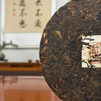 2023 Jingmai Mountain Ancient Tree Ripe Pu-erh Tea Cake (Shou) with intact tea leaves and detailed leaf appearance