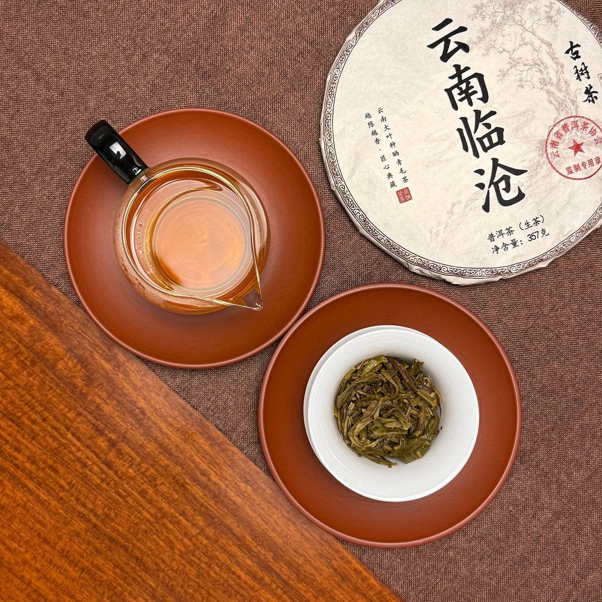 2024 Lin Cang Ancient Tree Raw Pu-erh Tea Cake with attractive tea liquor and opened brewed leaves.