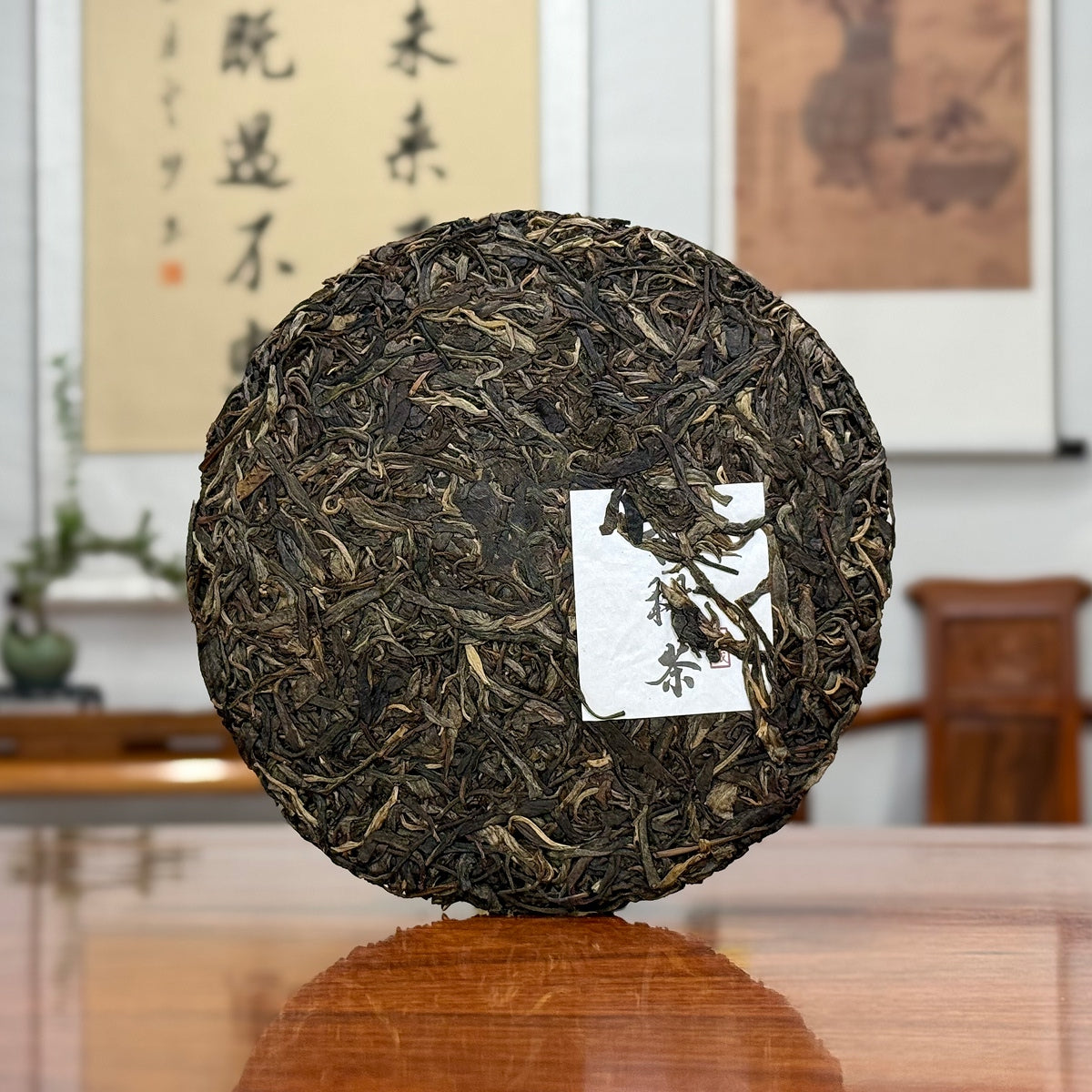 2024 Lin Cang Ancient Tree Raw Pu-erh Tea Cake showing detailed leaf texture from Yunnan tea leaves.