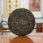 2024 Mei Zi Qing Raw Pu-erh Tea Cake showing Yunnan tea leaf details and texture