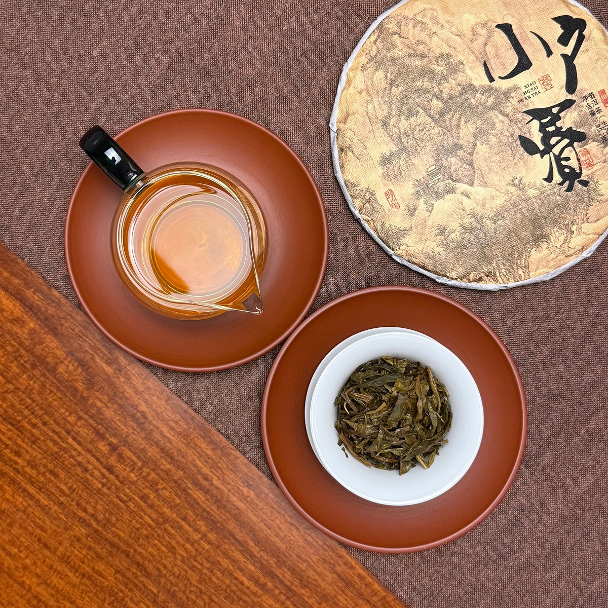 2024 Xiao Hu Sai Raw Pu-erh Tea Cake revealing brewed leaves and mineral-rich tea character